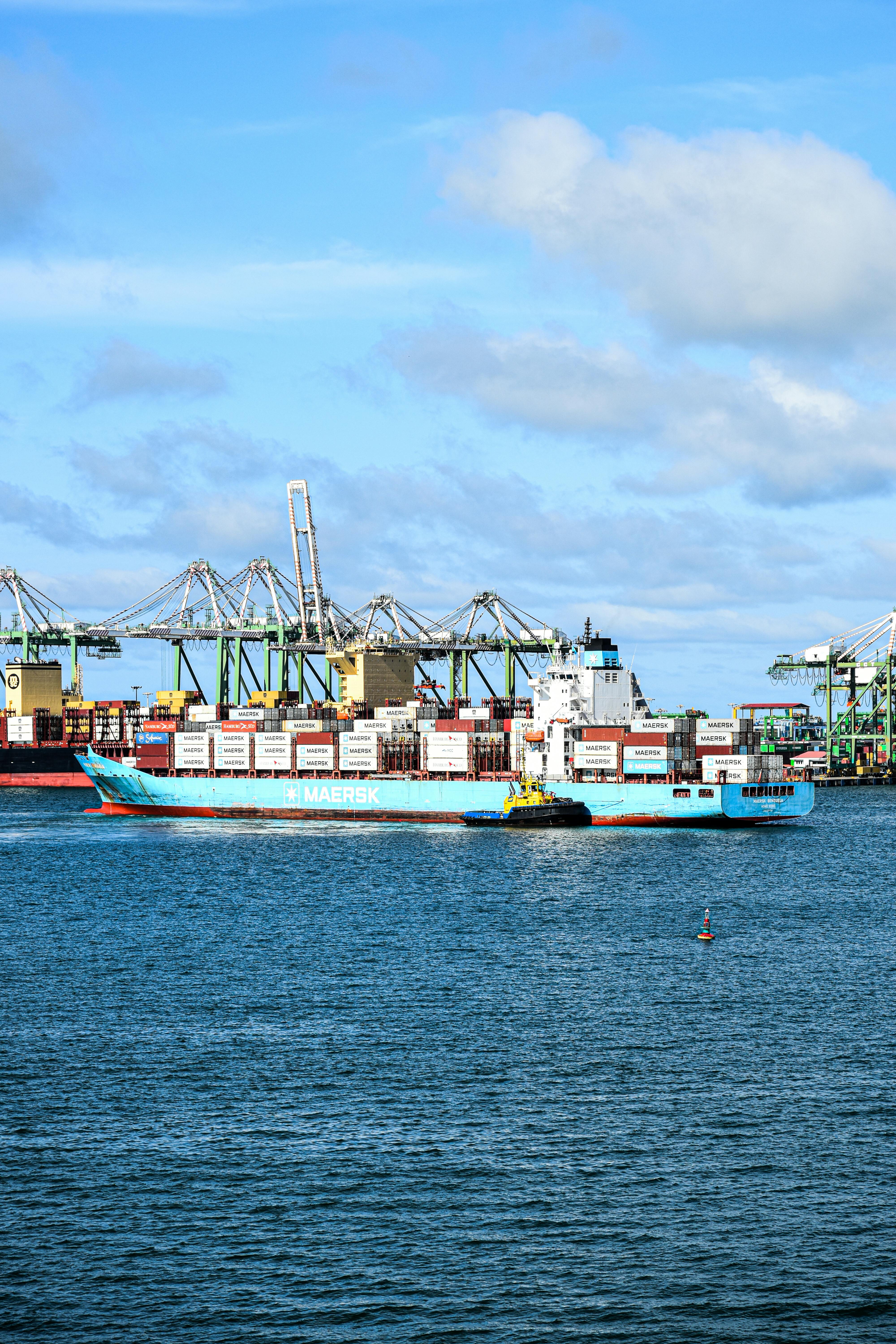 ITAR & Export Basics - Ship piled with shipping containers